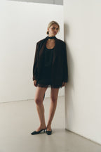 Сатинова міні спідниця з мереживом